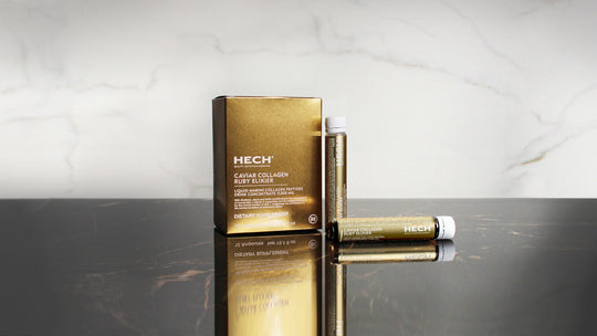 HECH-CAVIAR COLLAGEN RUBY ELIXIER Box and two ampoules on a black and white marble background